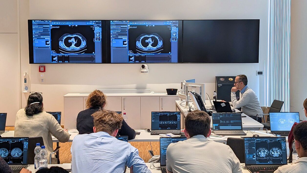 Participants at the RECIST and Beyond workshop in Cologne during hands-on training with mint Lesion for structured tumor response assessment.