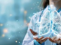 Image of a female doctor holding a hologram of a lung