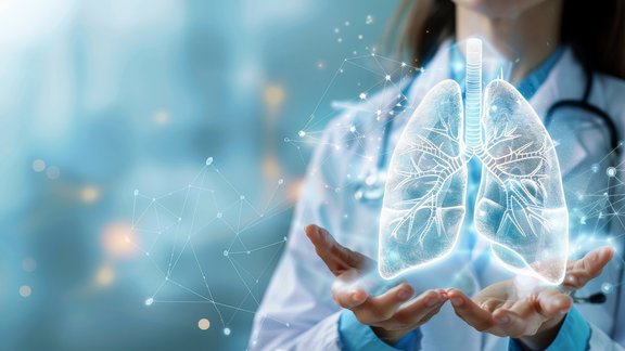 Image of a female doctor holding a hologram of a lung