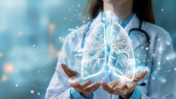 Image of a female doctor holding a hologram of a lung