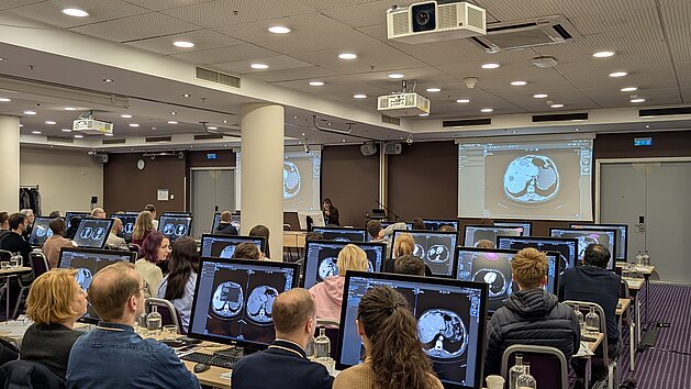 Radiologists reviewing oncologic imaging cases during the ESOI–EORTC Workshop on standardized tumor response assessment